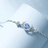 S925 Silver Deer Horn Bracelet featuring blue diamond and silver deer horn design against a soft blue backdrop.